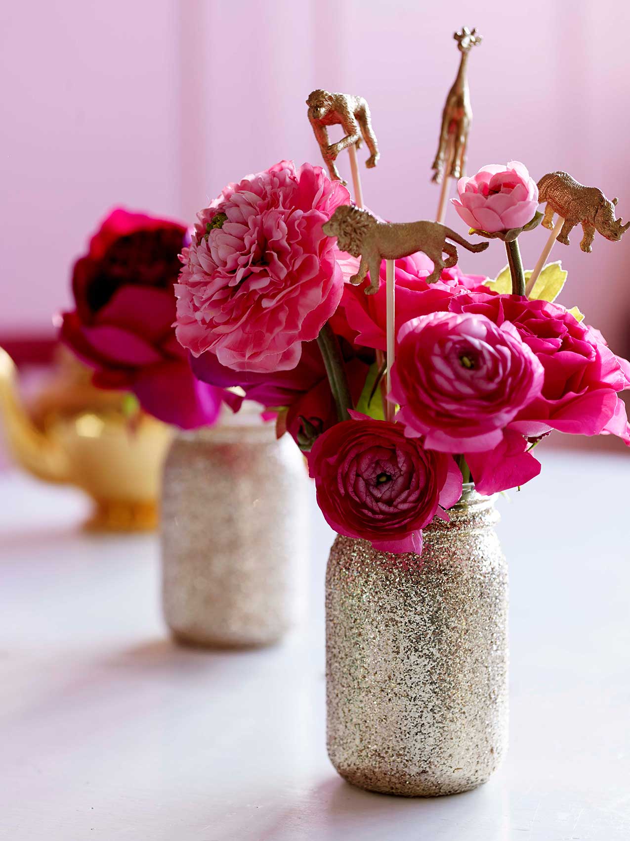 Talking-Tables---Be-Happy---Party-setting---glitter-jars,-party-animals---lifestyle---Portrait
