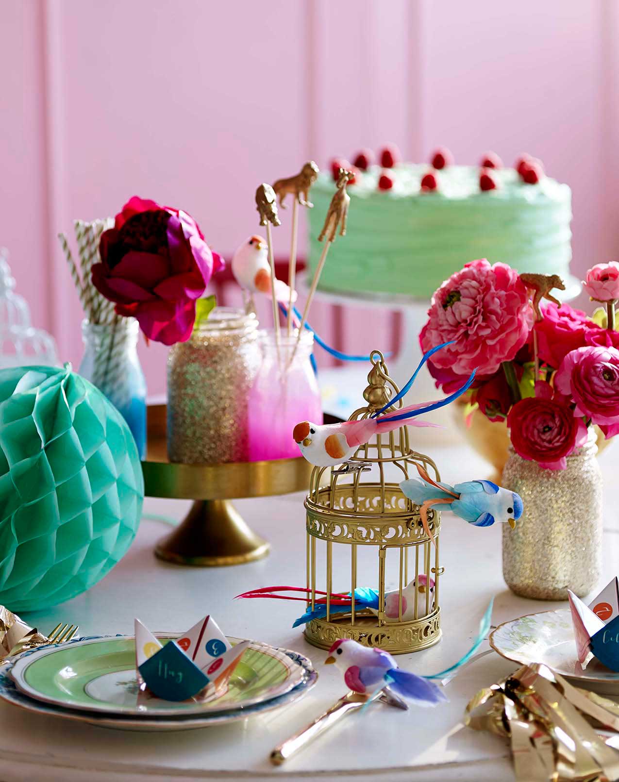 Talking-Tables---Be-Happy---Party-setting---metal-birdcage,-party-birdies,-glitter-jars,-jazzy-glass-jars,-fortune-tellers---lifestyle---Portrait