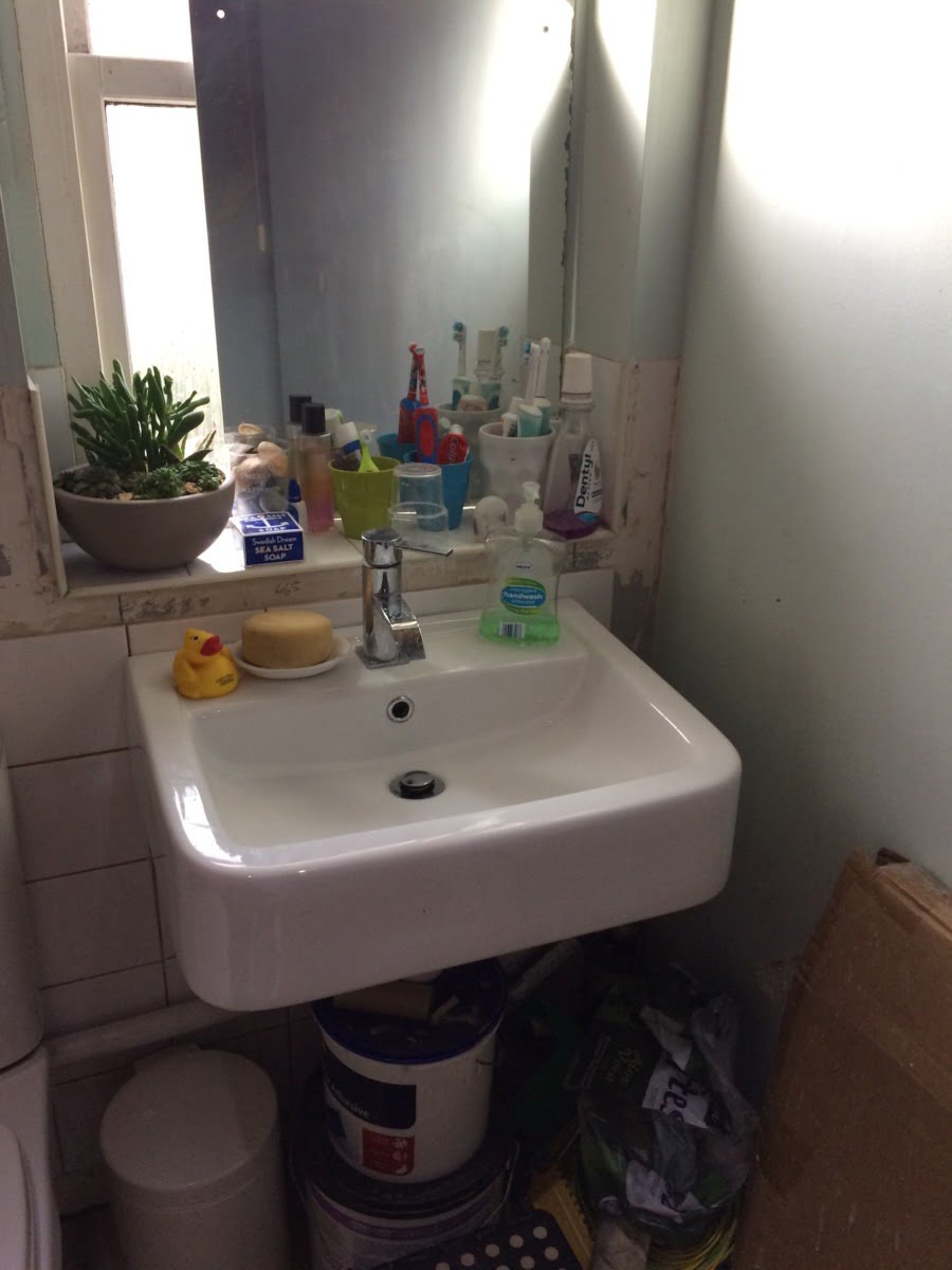 Is this my toughest makeover yet? My beautiful best friend, Nicola, has been living with this bathroom for SIX years. Yep, you read that right - six years with half-tiled walls, no flooring, a faulty bath and wonky shower head. Look at the dangling spotlights - ekk! I adore my best friend, and I wanted this hardworking mum-of-two to have the beautiful bathroom she deserves. Saying all that this bathroom makeover has to be one of my biggest challenges yet. I've donned my styling gloves, and set to work giving her the best bathroom makeover in possible the smallest-space-ever with the very generous help of Bathroom Takeaway and Tons of Tiles. Let me walk you through the planning stages and my ideas for the space. maxine brady welovehomeblog A before shot of the sink and mirror