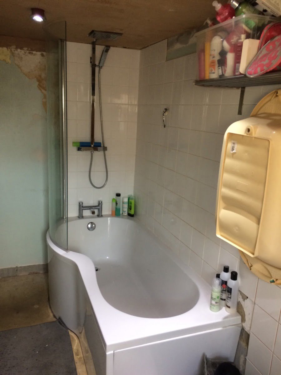 Is this my toughest makeover yet? My beautiful best friend, Nicola, has been living with this bathroom for SIX years. Yep, you read that right - six years with half-tiled walls, no flooring, a faulty bath and wonky shower head. Look at the dangling spotlights - ekk! I adore my best friend, and I wanted this hardworking mum-of-two to have the beautiful bathroom she deserves. Saying all that this bathroom makeover has to be one of my biggest challenges yet. I've donned my styling gloves, and set to work giving her the best bathroom makeover in possible the smallest-space-ever with the very generous help of Bathroom Takeaway and Tons of Tiles. Let me walk you through the planning stages and my ideas for the space. maxine brady welovehomeblog A before shot of the bath tub and room