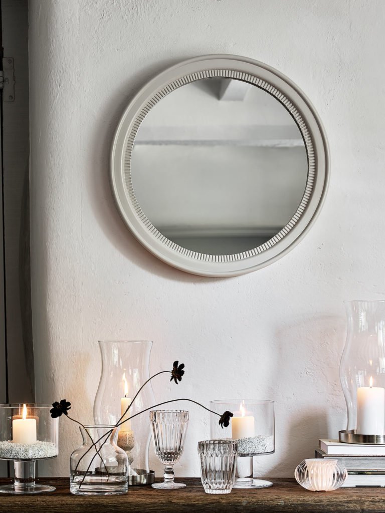 mirror nordic room with white walls and glass vases on shelf Winter styling