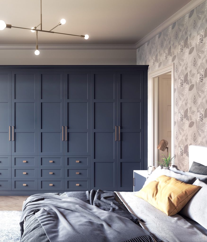 Be the first to see the plans for my bedroom makeover- (hint it has a coral wallpaper!) Blue fitted wardrobe with gold handles in bedroom